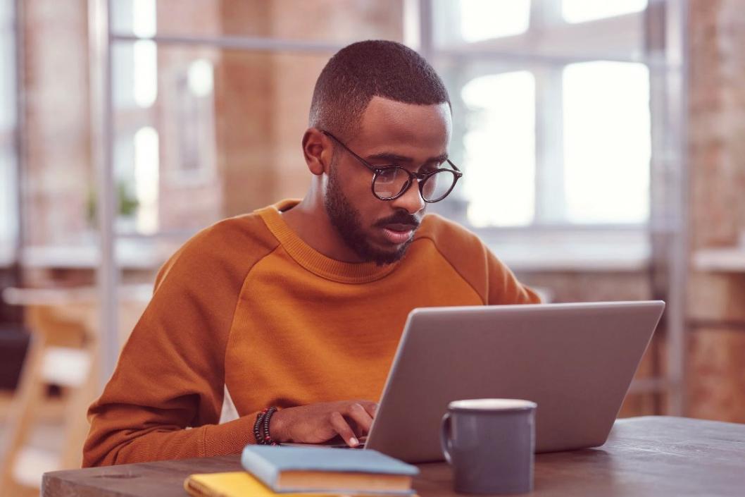 Student practicing mindful yoga stretches in a peaceful university environment