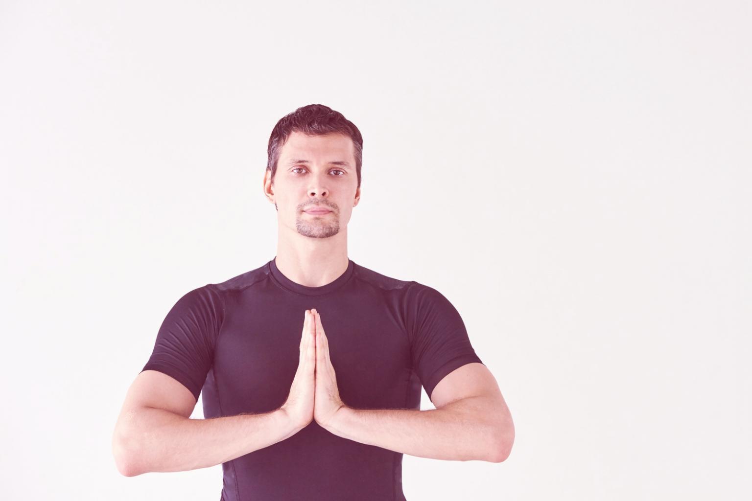 Instructor demonstrating proper alignment and technique during guided practice
